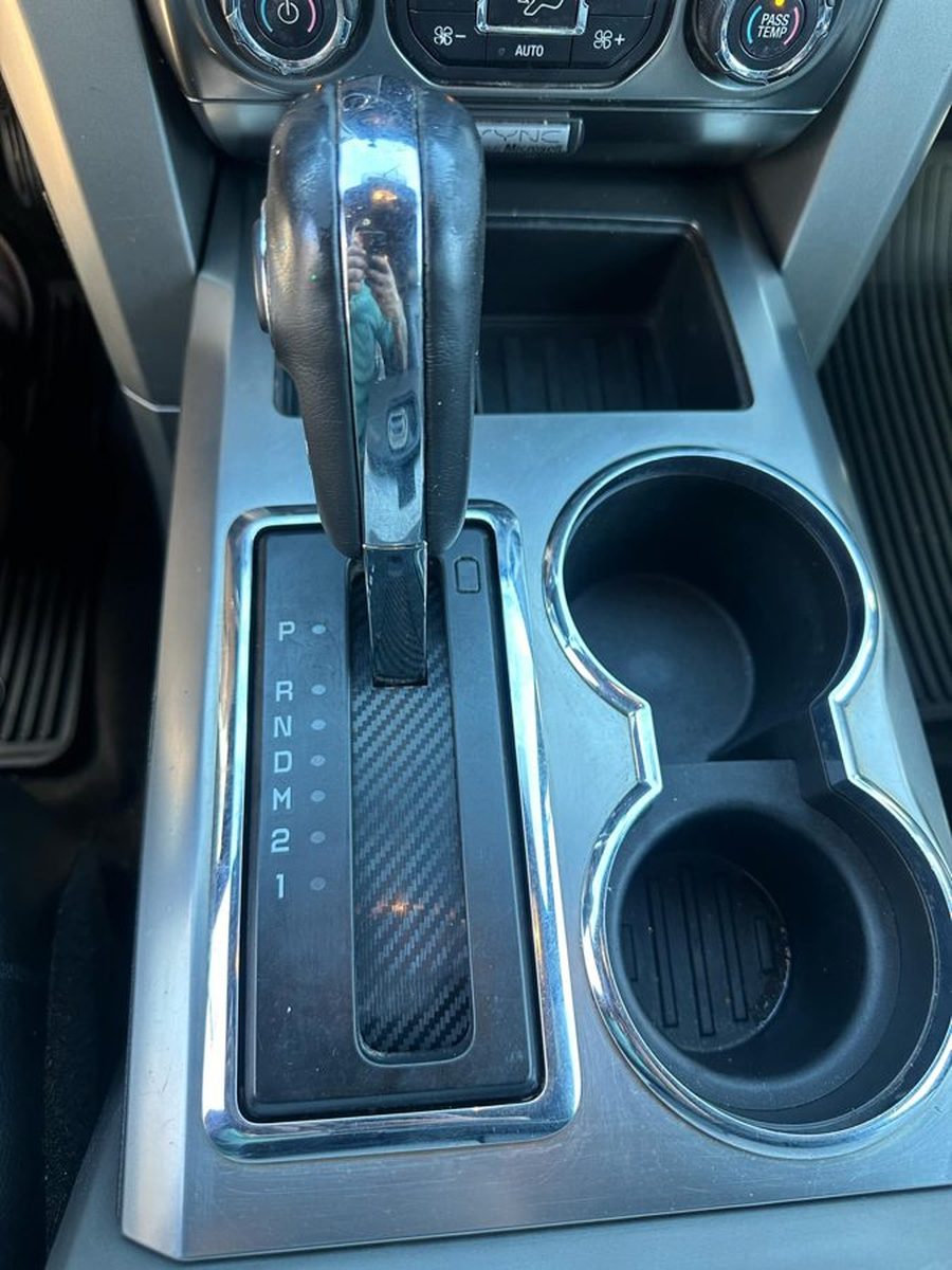 The Rev Layers bezel installed in the console, seated flush around the shifter.