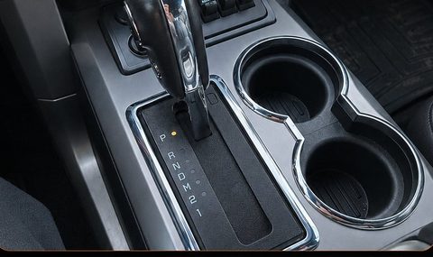 The bezel installed in the console, textured black